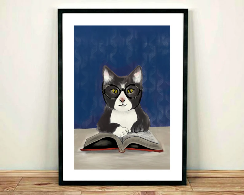 cat readin book with glasses on artwork